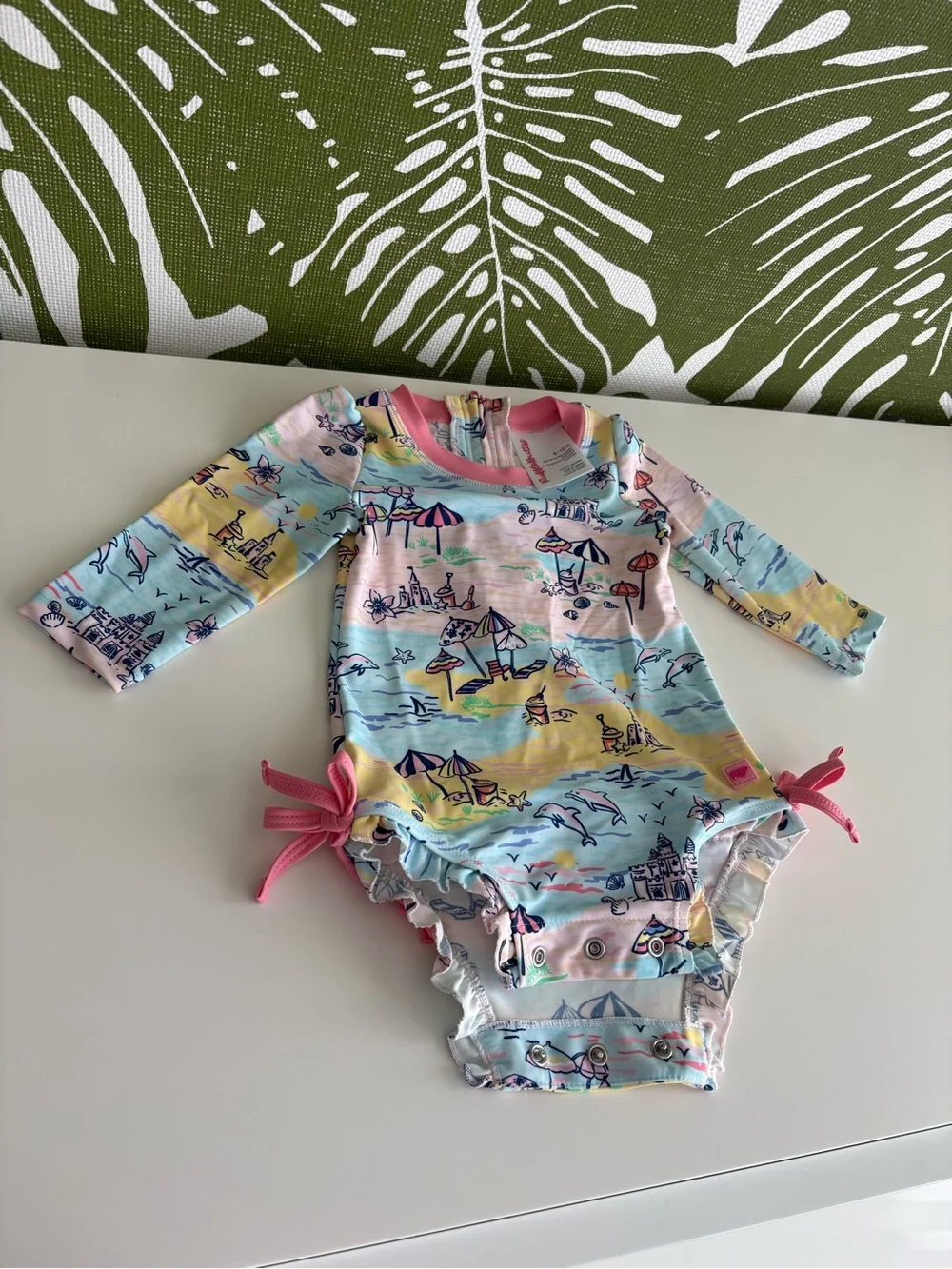 RuffleButts Pink-Trim Pastel Beach Print Rashguard Onesie⛱️